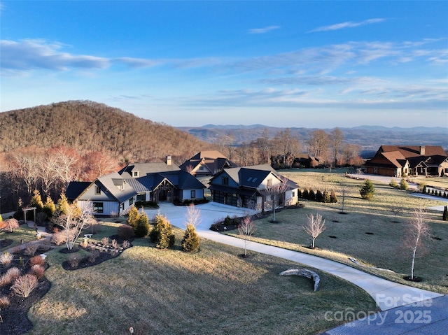 drone / aerial view featuring a mountain view