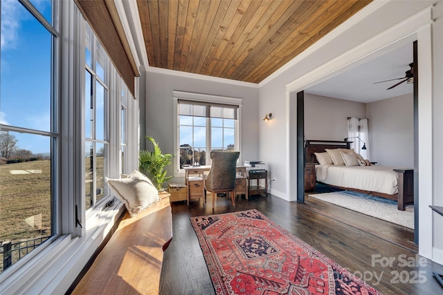 bedroom with wooden ceiling, wood finished floors, baseboards, and ornamental molding