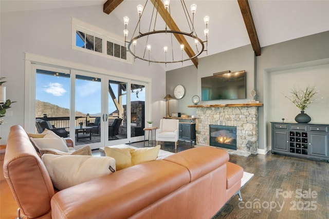 living area featuring high vaulted ceiling, an inviting chandelier, a stone fireplace, dark wood-type flooring, and beamed ceiling