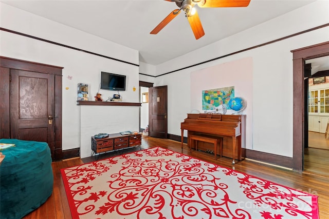 interior space featuring ceiling fan and wood-type flooring