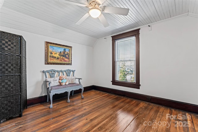 living area featuring ceiling fan, dark hardwood / wood-style flooring, and lofted ceiling