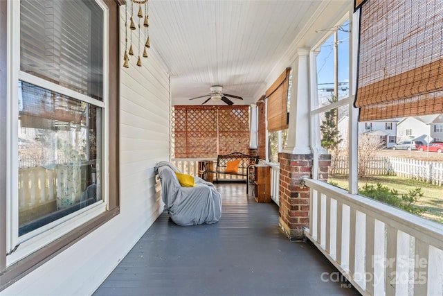 sunroom featuring ceiling fan