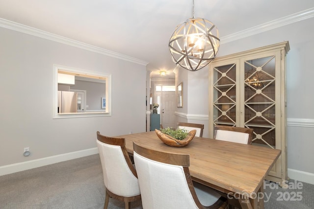 dining room with carpet, an inviting chandelier, and crown molding