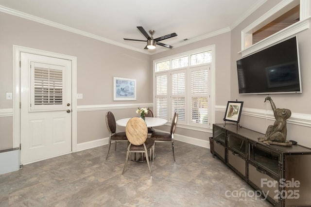 dining room featuring ceiling fan and ornamental molding