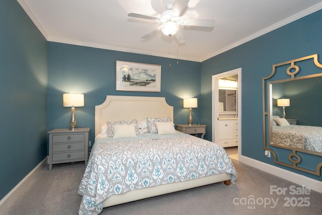 bedroom featuring carpet, ensuite bath, ceiling fan, and ornamental molding