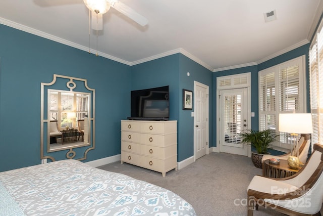 carpeted bedroom with ceiling fan and ornamental molding