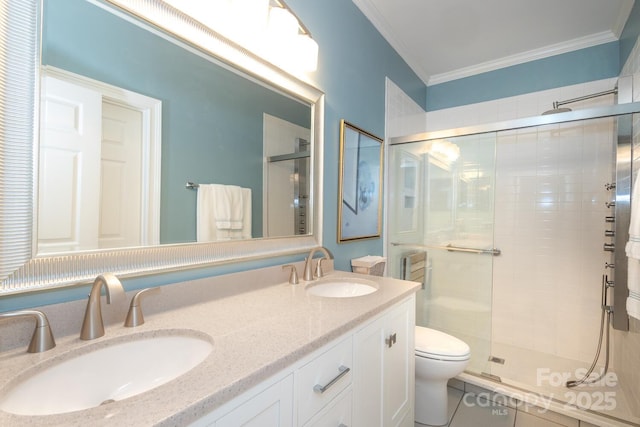 bathroom with tile patterned floors, vanity, crown molding, toilet, and a shower with shower door