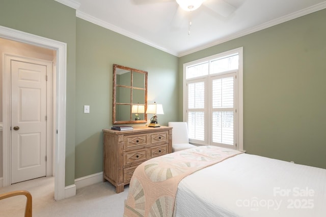 carpeted bedroom with ceiling fan and crown molding