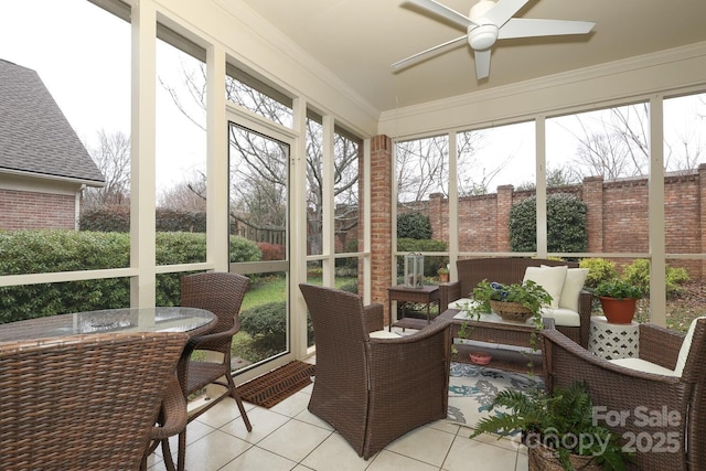 sunroom featuring ceiling fan