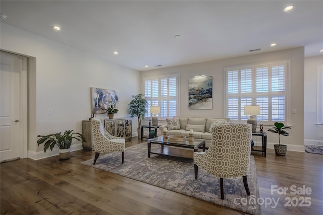 living room with dark hardwood / wood-style flooring