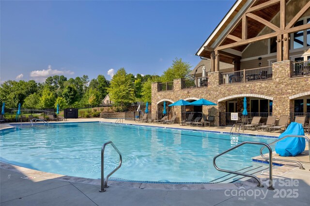 view of pool featuring a patio area