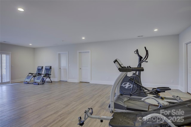 workout area featuring light hardwood / wood-style floors