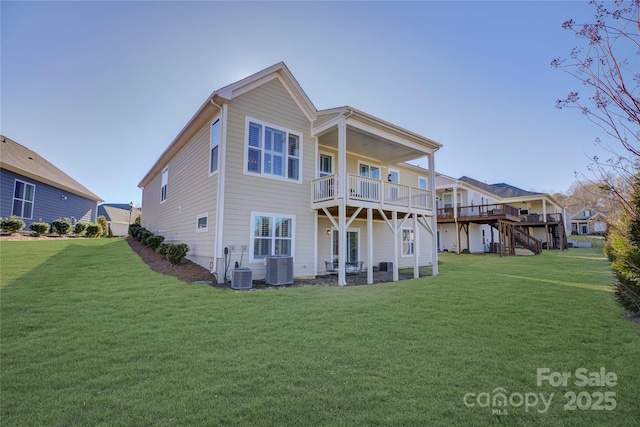 back of property featuring cooling unit, a lawn, and a deck