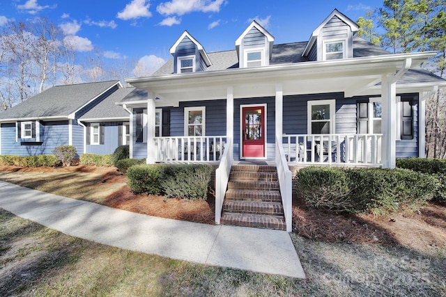 new england style home with a porch