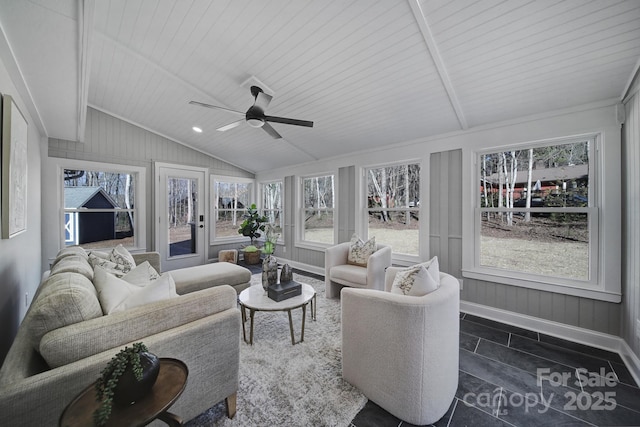 sunroom / solarium with plenty of natural light, wooden ceiling, ceiling fan, and vaulted ceiling