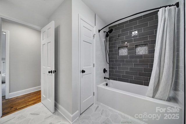 bathroom featuring tile patterned floors and shower / bath combo with shower curtain