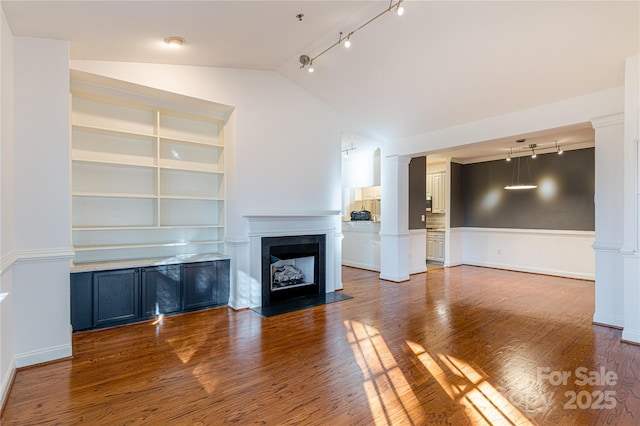 unfurnished living room featuring built in shelves, dark hardwood / wood-style flooring, and vaulted ceiling