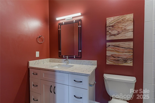 bathroom with vanity and toilet