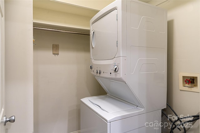 laundry room featuring stacked washer / dryer