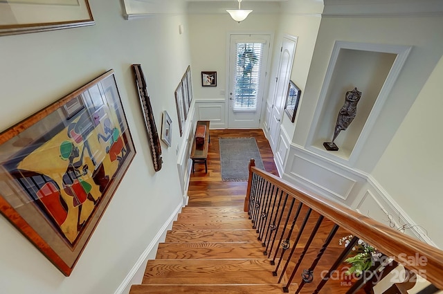 stairs with wood-type flooring