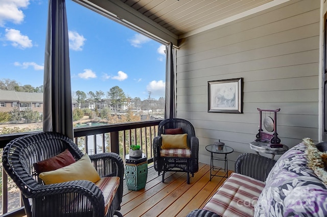 sunroom featuring wood ceiling