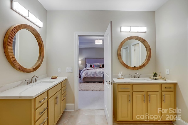 bathroom with vanity and tile patterned flooring