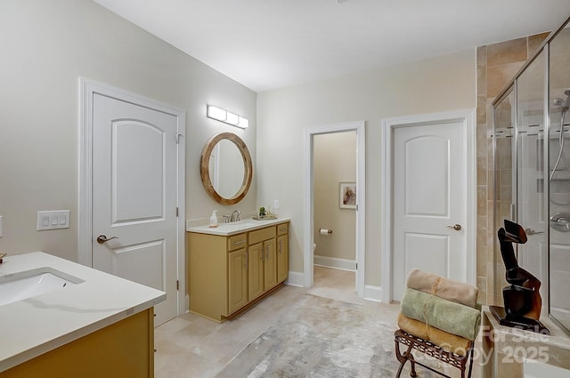 bathroom featuring vanity and an enclosed shower