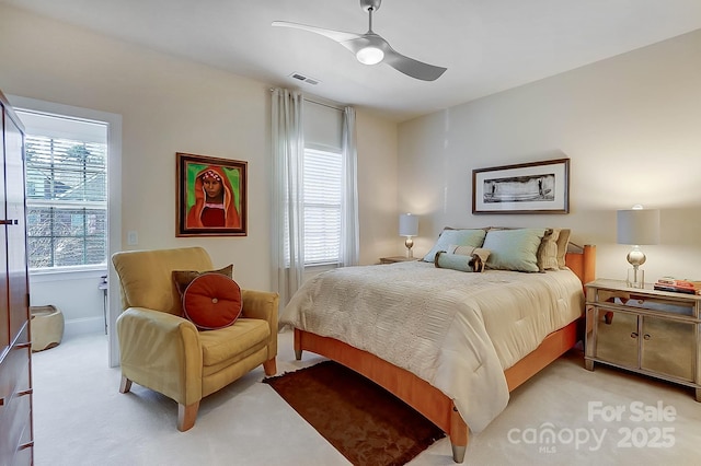 carpeted bedroom with ceiling fan