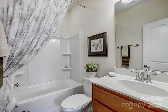 full bathroom featuring vanity, shower / tub combo, and toilet