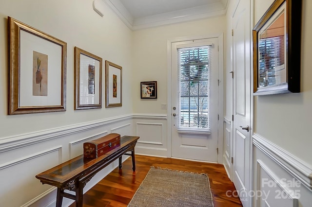 doorway with crown molding and dark wood-type flooring