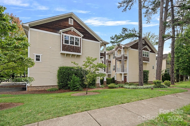 view of side of home featuring a yard