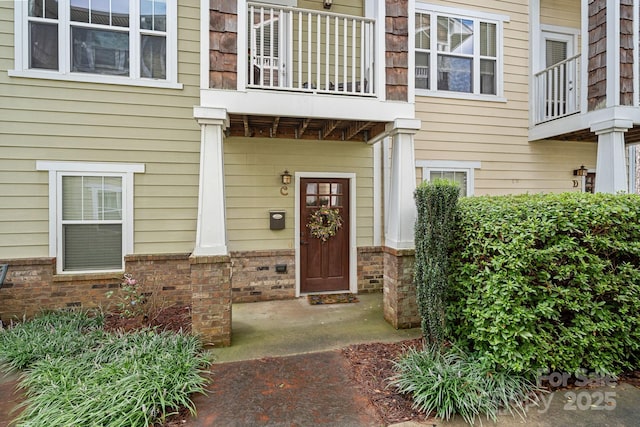 property entrance with a balcony