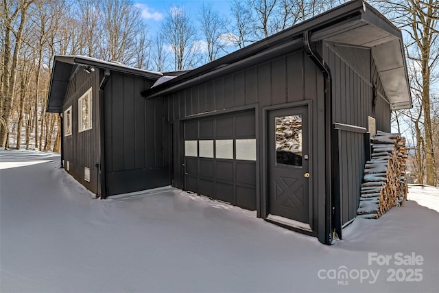 view of snow covered garage