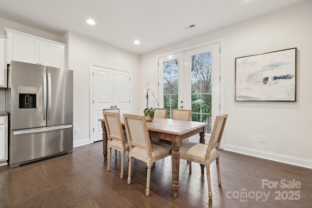 dining room featuring french doors and dark hardwood / wood-style floors