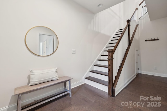 stairway featuring wood-type flooring