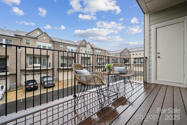 wooden deck featuring central air condition unit