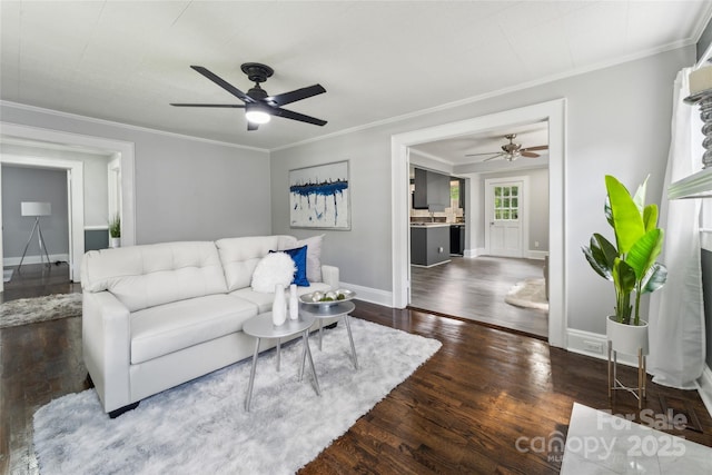 living room featuring ceiling fan, crown molding, and dark wood-type flooring