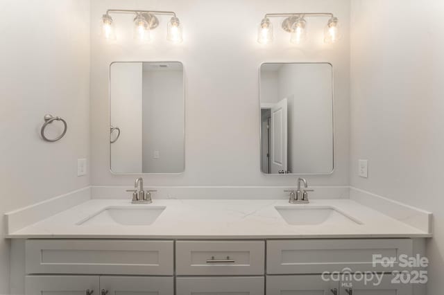 bathroom with double vanity and a sink