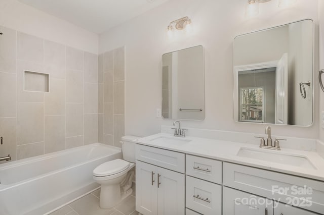 full bathroom with bathtub / shower combination, vanity, toilet, and tile patterned flooring