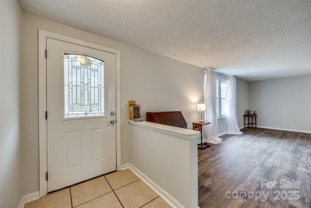 foyer with a textured ceiling