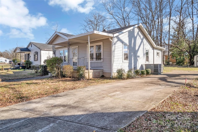 view of front of property with covered porch and cooling unit