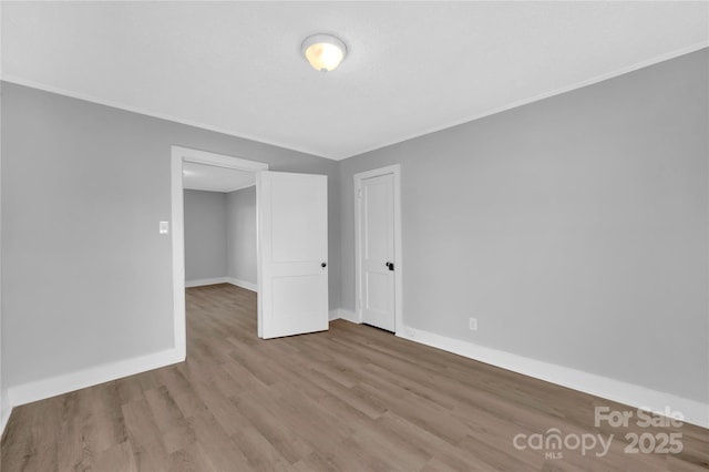 unfurnished bedroom featuring light wood-type flooring