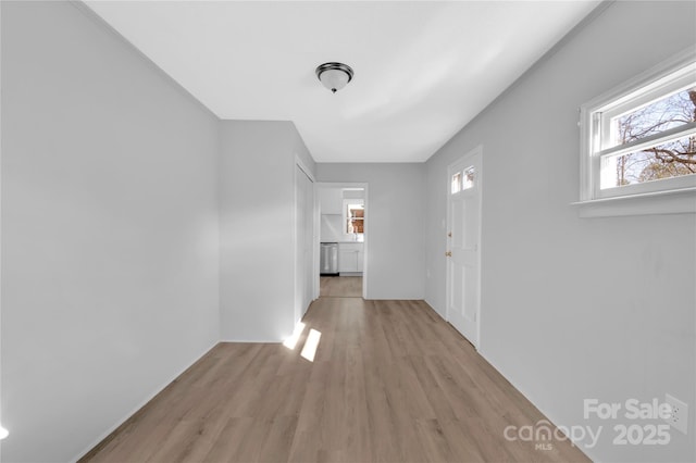 hall with light hardwood / wood-style floors