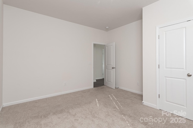 unfurnished bedroom with light colored carpet