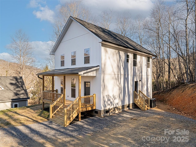 view of front of house featuring central air condition unit and a porch