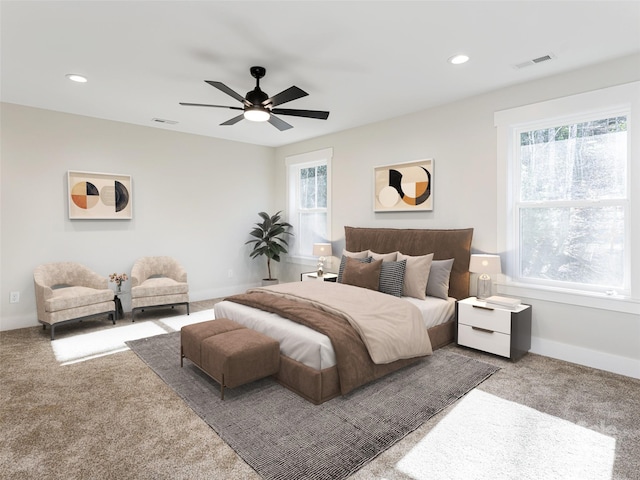 bedroom with ceiling fan and carpet floors