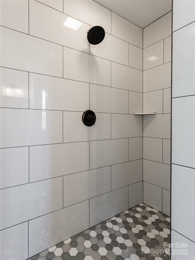 bathroom with a tile shower