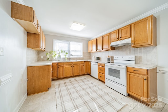 kitchen with ornamental molding, sink, decorative backsplash, and white appliances