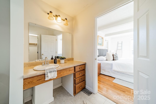 bathroom featuring vanity and tile patterned flooring