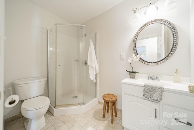 bathroom with toilet, tile patterned floors, a shower with door, and vanity